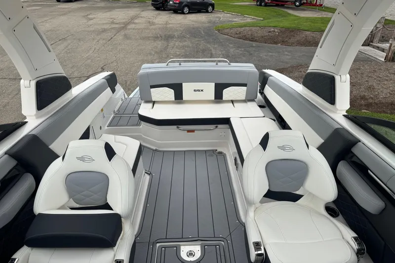 Slide: The Image of 2026 Chaparral 8 SSX boat interior with luxurious seating and modern design. - 18