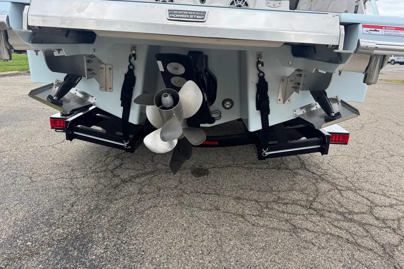 Slide: The Image of 2026 Chaparral 8 SSX boat stern with dual propellers and trim tabs. - 4