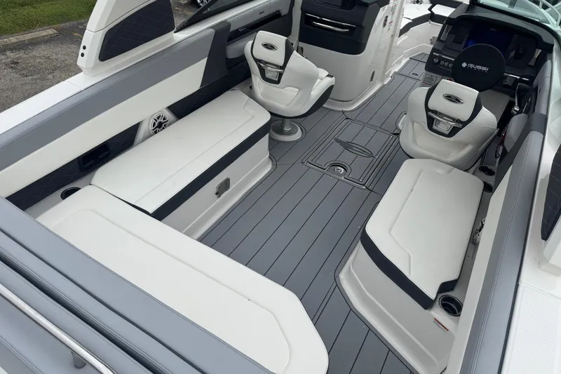 Slide: The Image of 2026 Chaparral 8 SSX boat interior with sleek seating and modern dashboard design. - 9