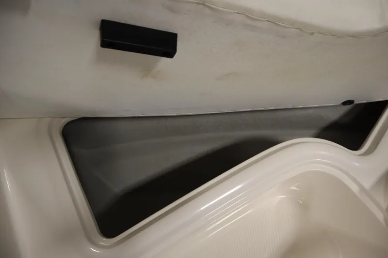 Slide: The Image of 2013 Bayliner 175 Bowrider interior storage compartment detail. - 12