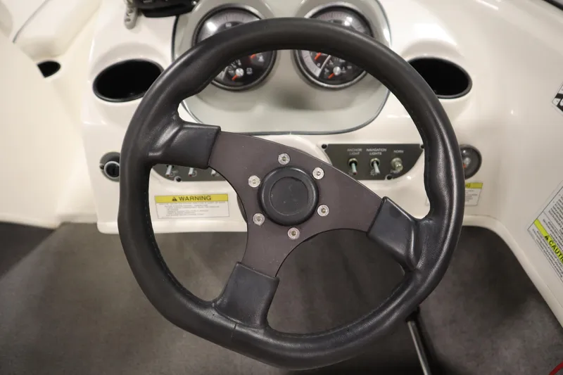 Slide: The Image of Steering wheel and dashboard of 2013 Bayliner 175 Bowrider boat. - 16