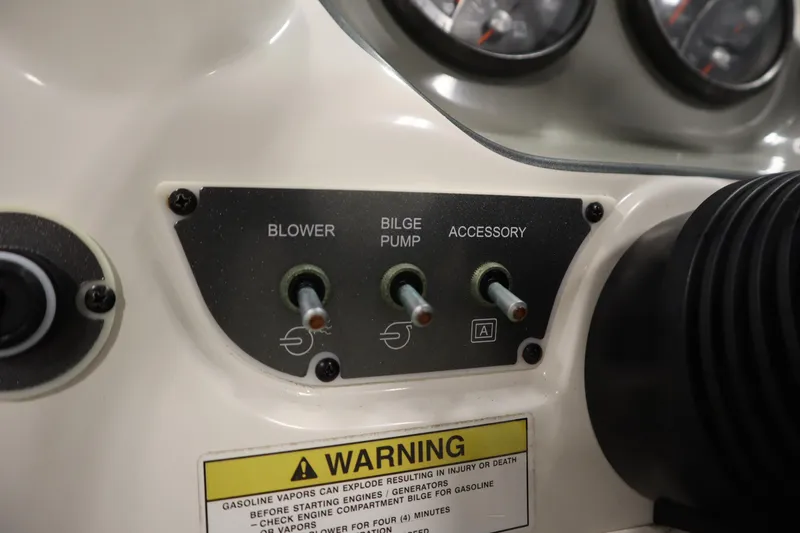 Slide: The Image of Control panel of a 2013 Bayliner 175 Bowrider boat with switches and warning label. - 19