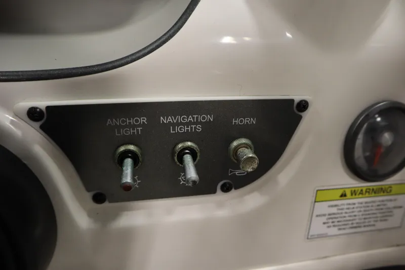 Slide: The Image of Control panel of a 2013 Bayliner 175 Bowrider with switches for lights and horn. - 20