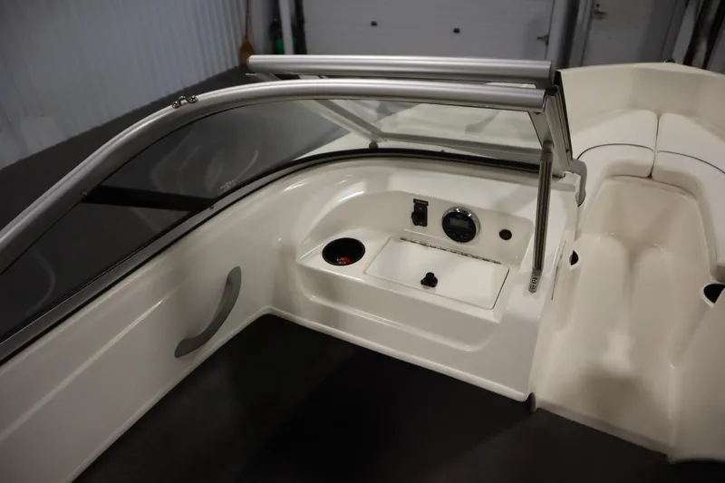 Slide: The Image of 2013 Bayliner 175 Bowrider interior with dashboard and seating area. - 25