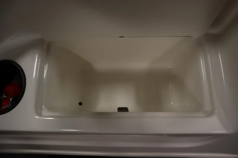 Slide: The Image of Storage compartment in 2013 Bayliner 175 Bowrider boat, featuring a clean, spacious interior. - 27