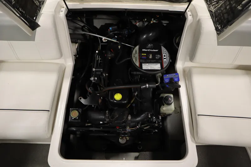 Slide: The Image of 2013 Bayliner 175 Bowrider engine compartment with MerCruiser 3.0L engine. - 32