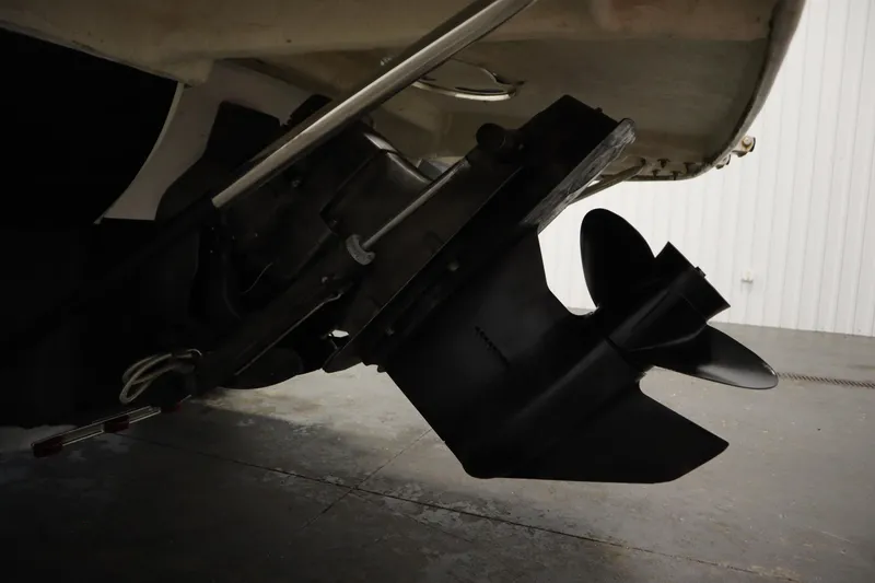 Slide: The Image of 2013 Bayliner 175 Bowrider boat propeller and stern drive in a garage. - 37
