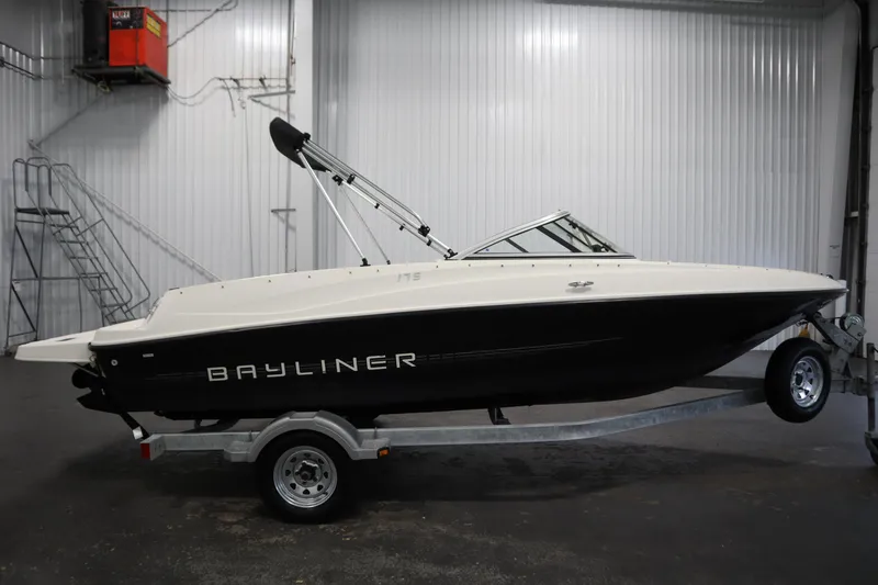 Slide: The Image of 2013 Bayliner 175 Bowrider boat on trailer in indoor storage facility. - 4