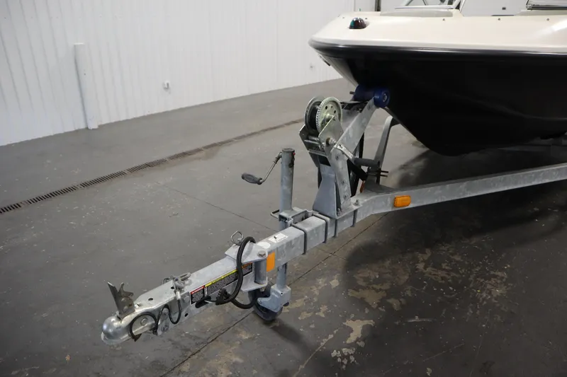 Slide: The Image of 2013 Bayliner 175 Bowrider on trailer in indoor storage facility. - 40