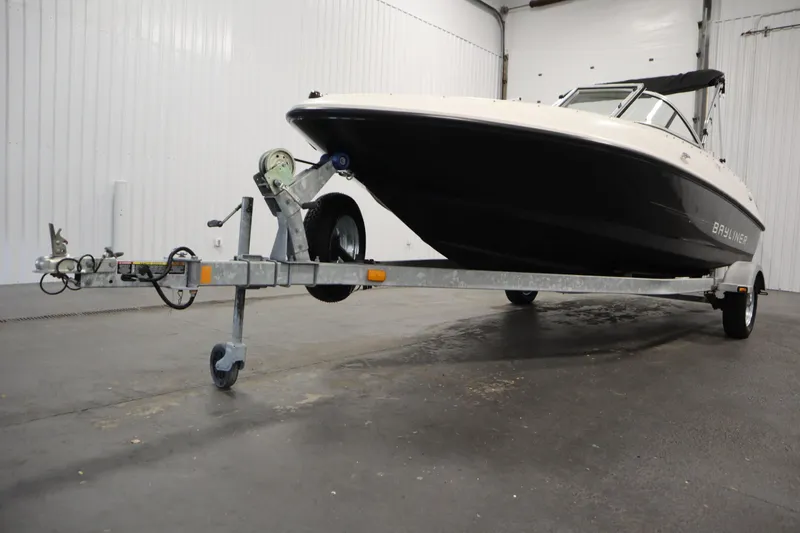 Slide: The Image of 2013 Bayliner 175 Bowrider on trailer in indoor storage facility. - 42