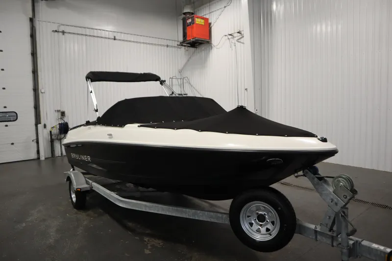 Slide: The Image of 2013 Bayliner 175 Bowrider boat on trailer in indoor storage facility. - 44