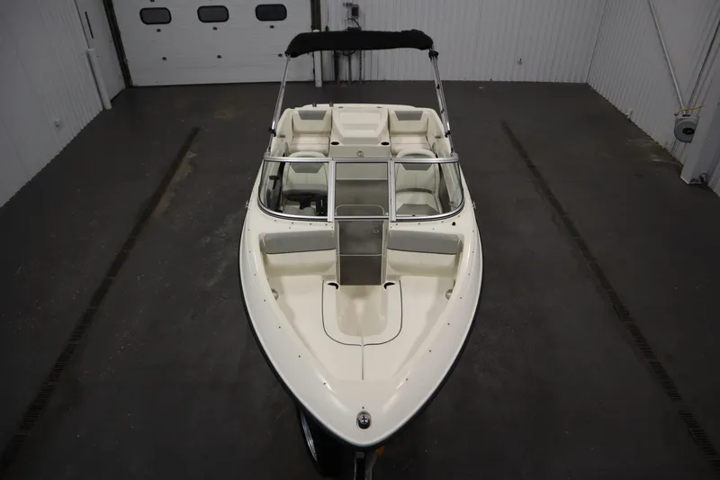Slide: The Image of 2013 Bayliner 175 Bowrider boat in indoor storage, top view. - 9