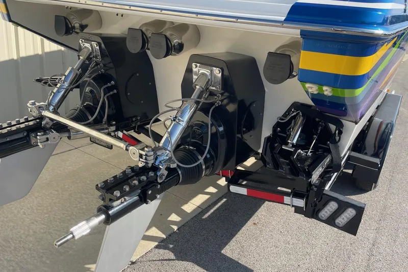 Slide: The Image of Rear view of a 2004 Formula 382 FASTech boat with dual outboard motors. - 10