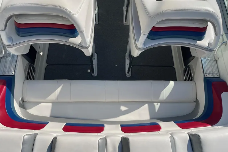 Slide: The Image of 2004 Formula 382 FASTech boat interior with white, red, and blue seating. - 16