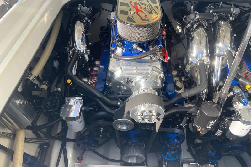 Slide: The Image of Engine of a 2004 Formula 382 FASTech boat, showcasing detailed components and chrome accents. - 19