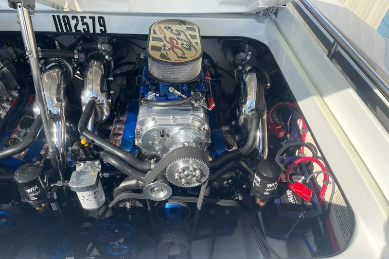 Slide: The Image of Engine compartment of a 2004 Formula 382 FASTech boat, showcasing detailed components. - 20