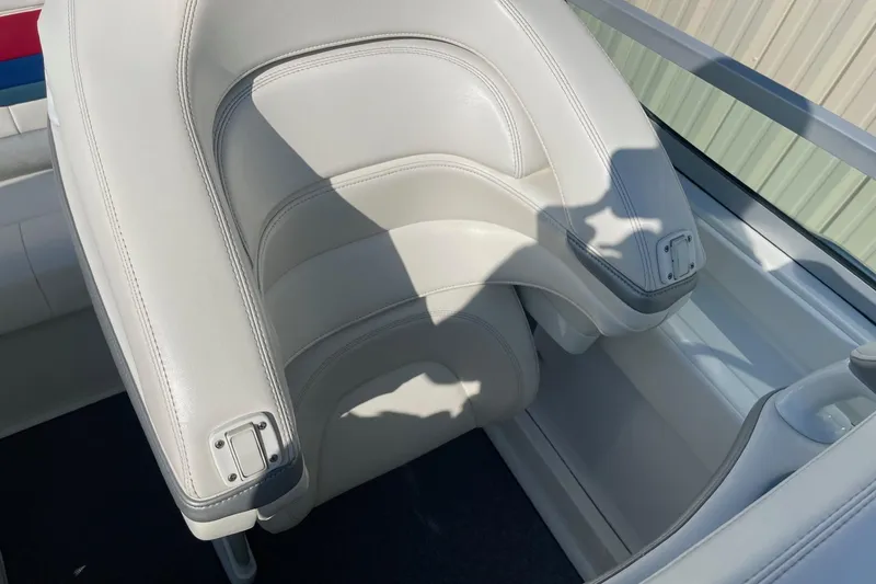 Slide: The Image of 2004 Formula 382 FASTech boat seat with white leather upholstery and sleek design. - 23