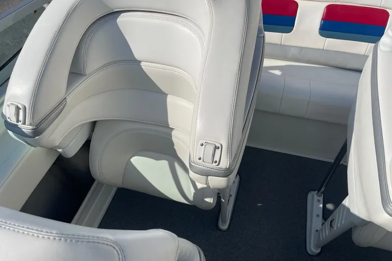 Slide: The Image of 2004 Formula 382 FASTech boat interior with white leather seats and colorful accents. - 24
