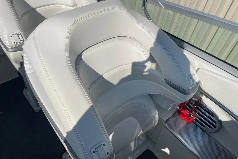 Slide: The Image of 2004 Formula 382 FASTech boat interior with white leather seating and sleek design. - 25
