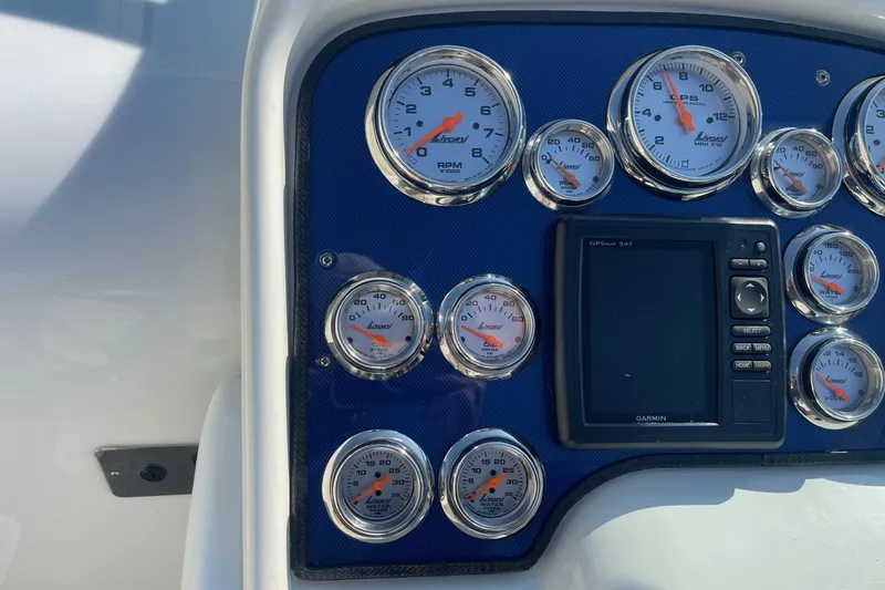 Slide: The Image of Dashboard of a 2004 Formula 382 FASTech boat with gauges and Garmin GPS. - 29