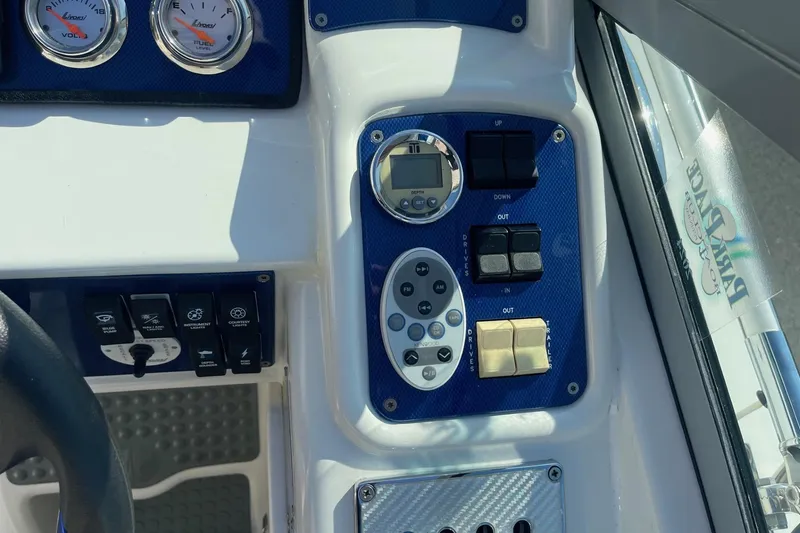 Slide: The Image of Control panel of a 2004 Formula 382 FASTech boat with gauges and switches. - 31