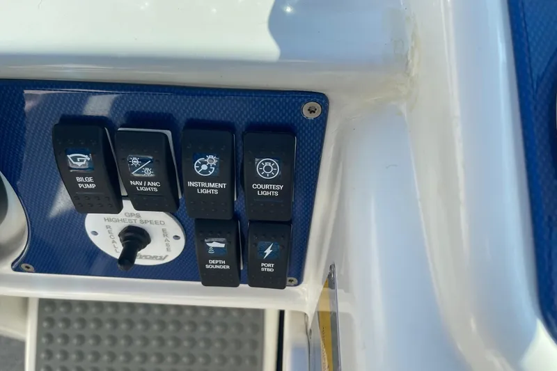 Slide: The Image of Control panel of a 2004 Formula 382 FASTech boat with various switches and GPS settings. - 33
