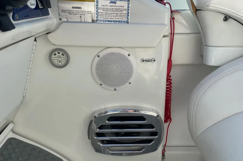 Slide: The Image of 2004 Formula 382 FASTech boat interior with speaker, control panel, and red safety cord. - 34