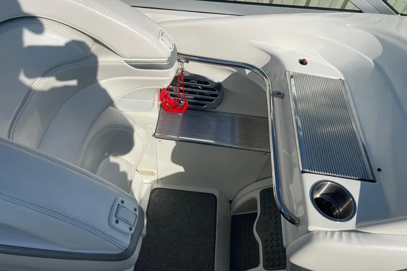 Slide: The Image of 2004 Formula 382 FASTech boat interior with white seating and stainless steel accents. - 35