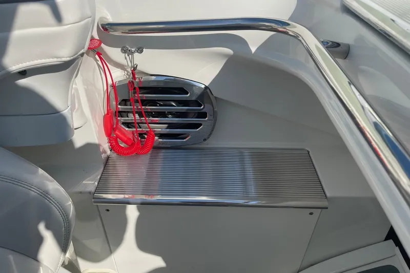 Slide: The Image of Interior of a 2004 Formula 382 FASTech boat, featuring sleek metal accents and red safety lanyard. - 36
