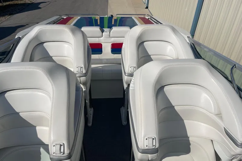 Slide: The Image of 2004 Formula 382 FASTech boat interior with white leather seats and colorful accents. - 37