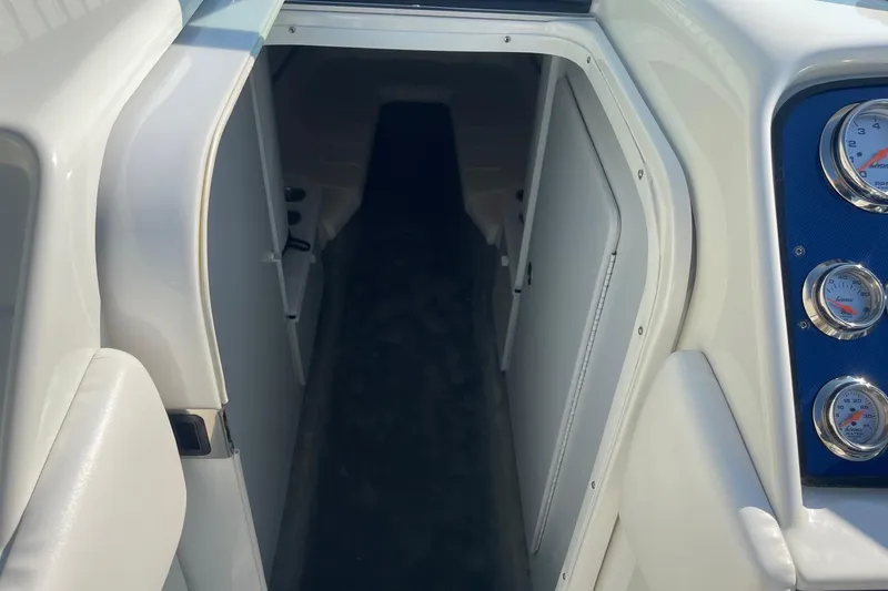 Slide: The Image of 2004 Formula 382 FASTech boat interior with gauges and cabin entrance. - 39