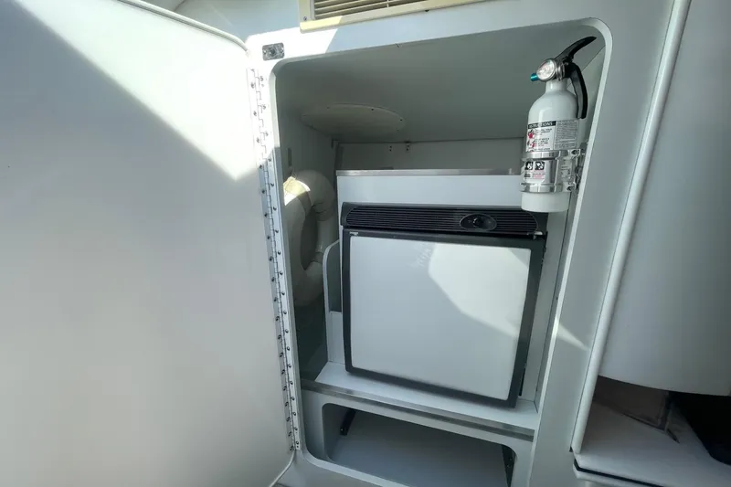 Slide: The Image of 2004 Formula 382 FASTech interior with mini fridge and fire extinguisher. - 43