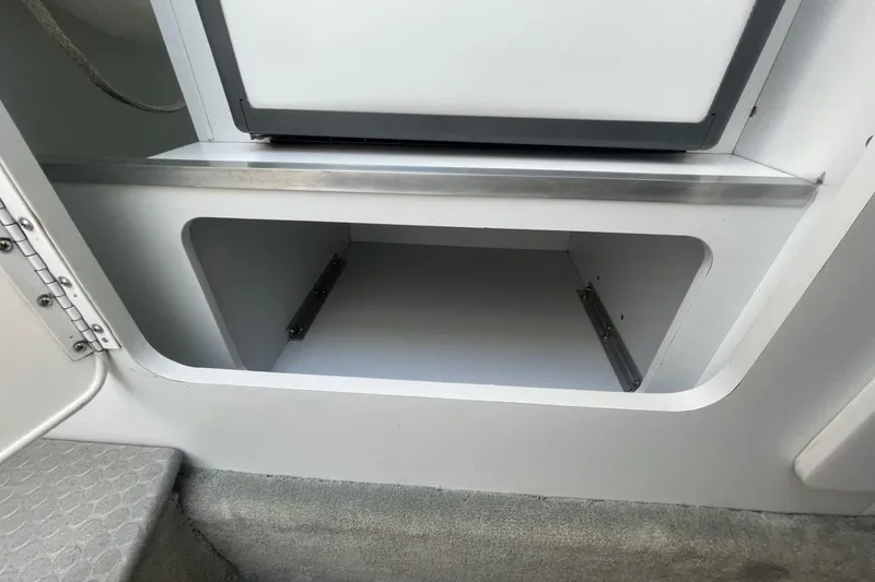 Slide: The Image of Open storage compartment in a 2004 Formula 382 FASTech boat interior. - 45