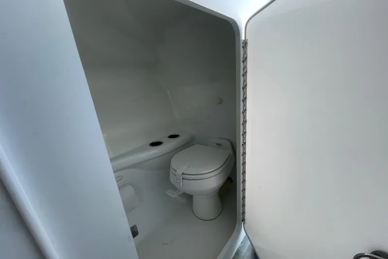 Slide: The Image of 2004 Formula 382 FASTech boat bathroom interior with white toilet and compact design. - 47