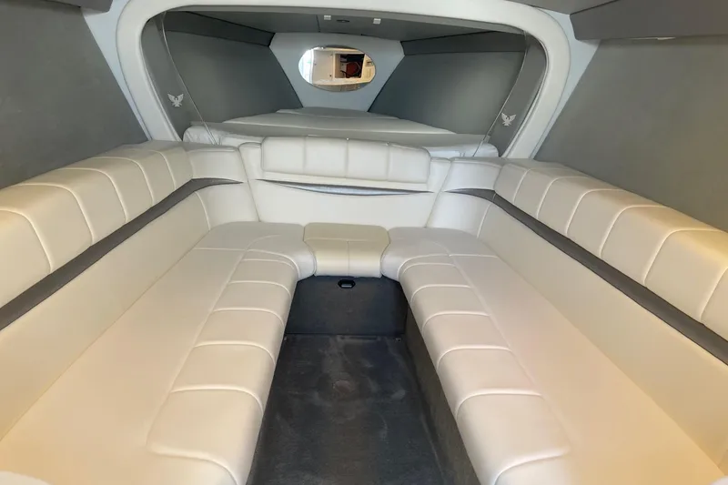 Slide: The Image of 2004 Formula 382 FASTech cabin interior with white leather seating and modern design. - 50