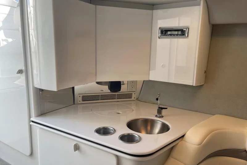 Slide: The Image of 2004 Formula 382 FASTech boat interior with sleek kitchenette and modern amenities. - 51