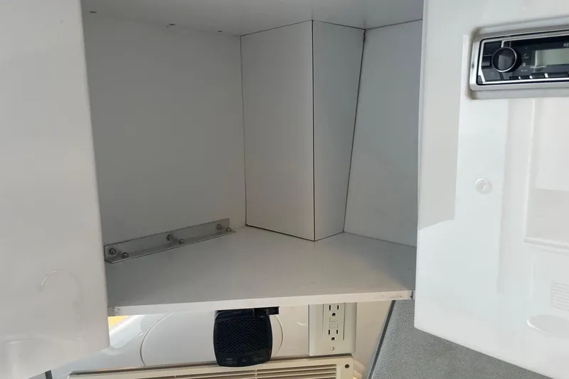 Slide: The Image of 2004 Formula 382 FASTech interior cabinet with stereo system and power outlet. - 54