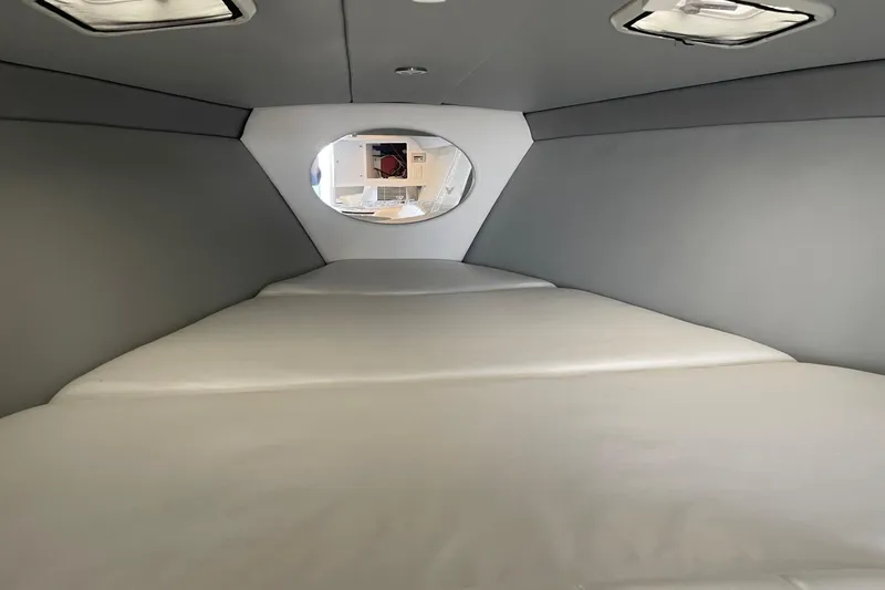 Slide: The Image of Interior cabin of a 2004 Formula 382 FASTech boat, featuring a spacious sleeping area. - 59