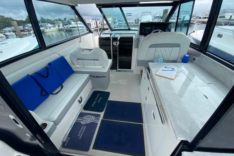 Slide: The Image of 2022 Regal 36 XO yacht interior with sleek countertop and modern amenities. - 10