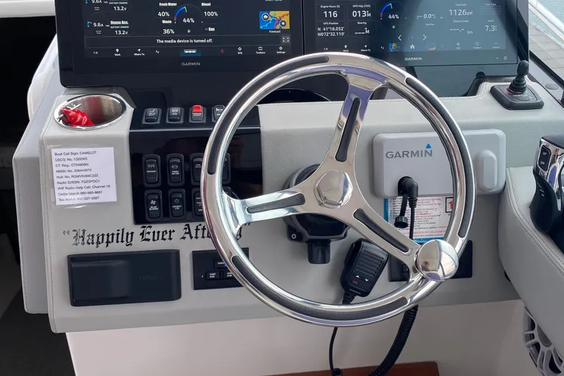 Slide: The Image of Interior of 2022 Regal 36 XO yacht with white seating and blue accents. - 15