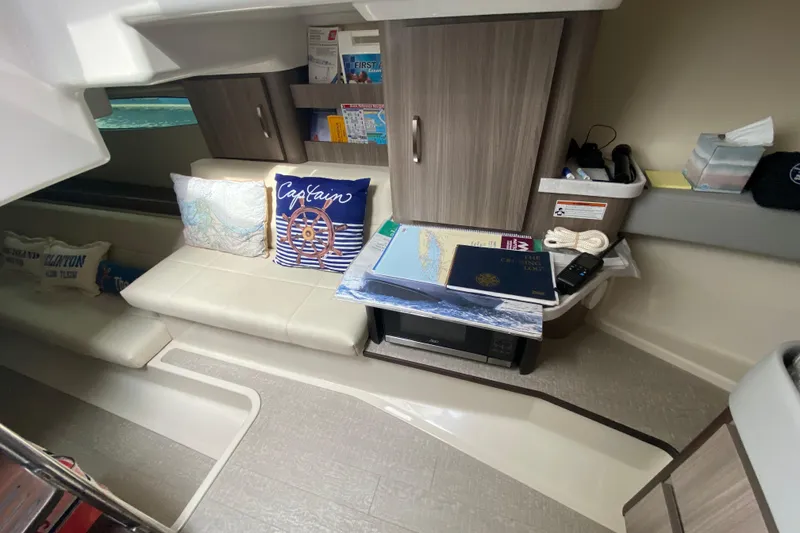 Slide: The Image of Interior cabin of 2022 Regal 36 XO yacht with bed and storage drawers. - 21