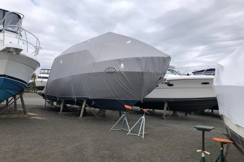 Slide: The Image of Control panel of a 2022 Regal 36 XO boat with various switches and circuit breakers. - 28