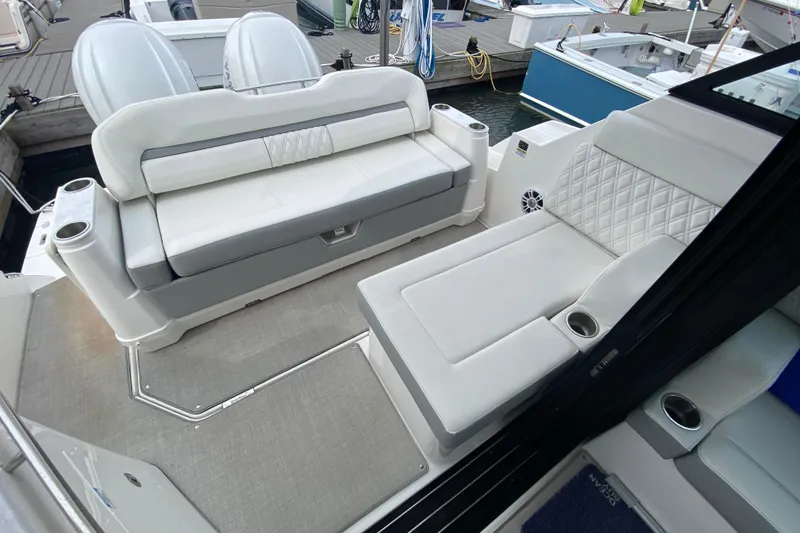 Slide: The Image of 2022 Regal 36 XO boat interior with Yamaha engines and white seating. - 8