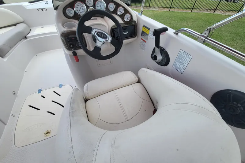 Slide: The Image of 2008 Tahoe 195 I/O boat cockpit with steering wheel and control panel. - 14