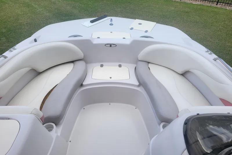 Slide: The Image of Interior view of a 2008 Tahoe 195 I/O boat with white seating. - 6
