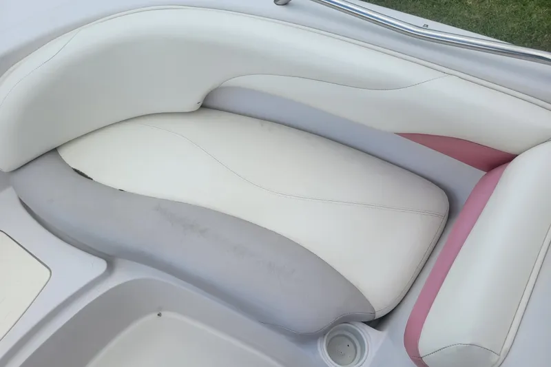 Slide: The Image of 2008 Tahoe 195 I/O boat interior seating with white and pink upholstery. - 8