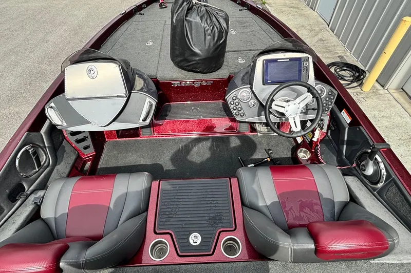 Slide: The Image of 2015 Ranger Z119 Comanche boat interior with dual seats and steering console. - 11