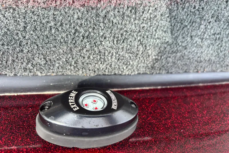 Slide: The Image of 2015 Ranger Z119 Comanche boat detail with Extreme brand component on red surface. - 13