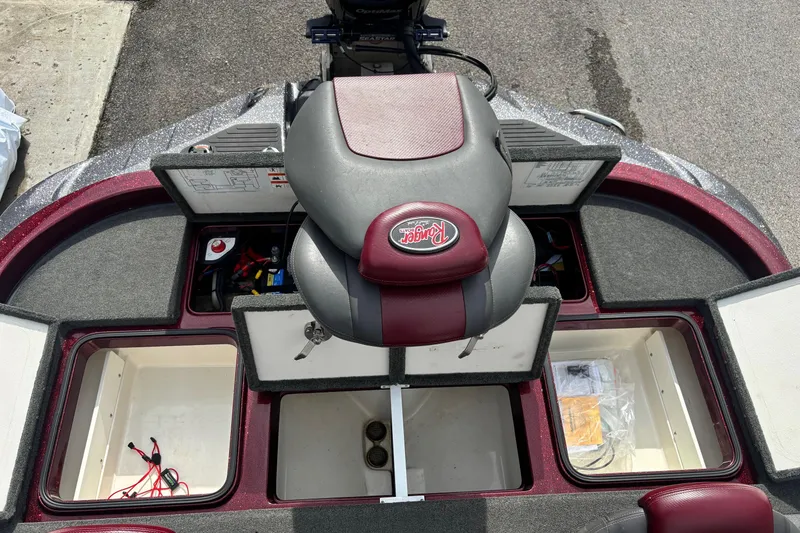 Slide: The Image of 2015 Ranger Z119 Comanche boat interior with open storage compartments and seat. - 15