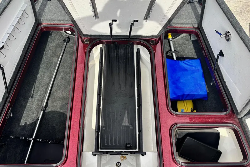 Slide: The Image of 2015 Ranger Z119 Comanche boat storage compartments with fishing gear and equipment. - 6